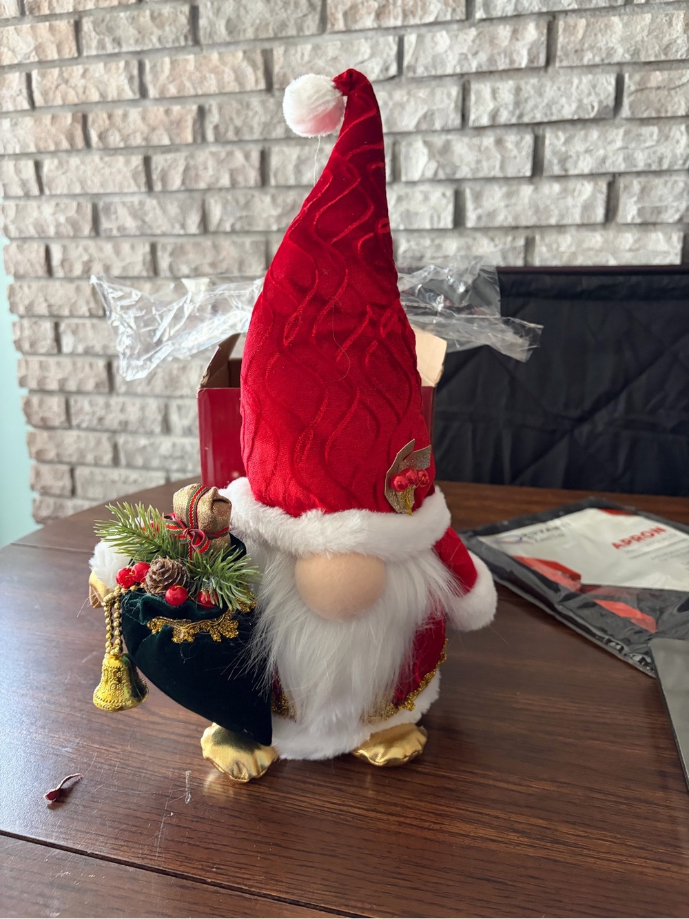 Red Santa Gnome Holiday Figurine with Festive Green Sack